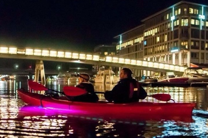 a person sitting on a boat in the water