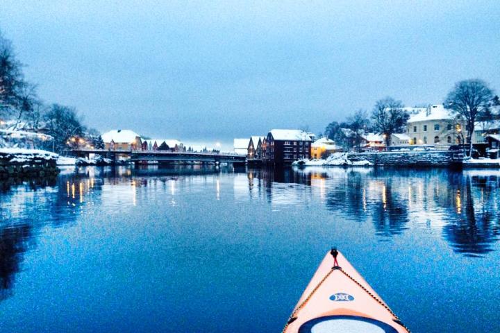 a boat is docked next to a body of water