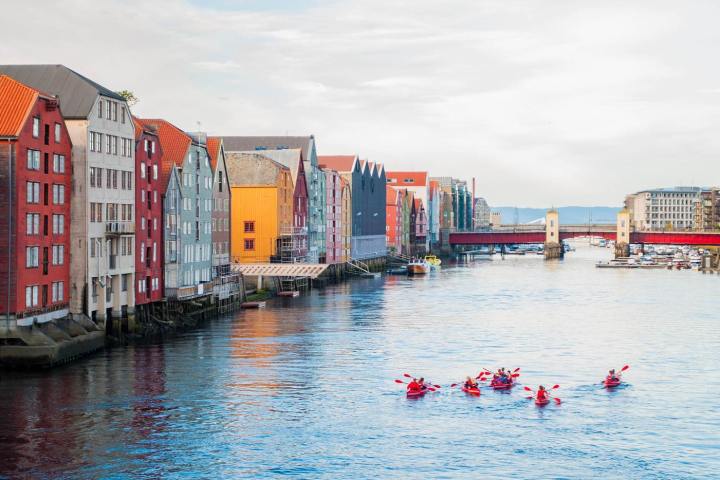 a small boat in a harbor next to a body of water