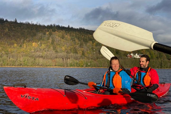 a man riding on the back of a boat