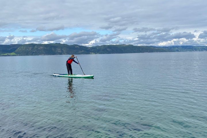 a man riding a wave on top of a body of water