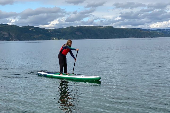 a man riding skis on a body of water