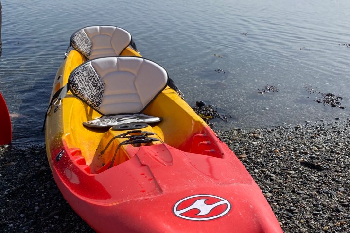 a boat sitting next to a body of water