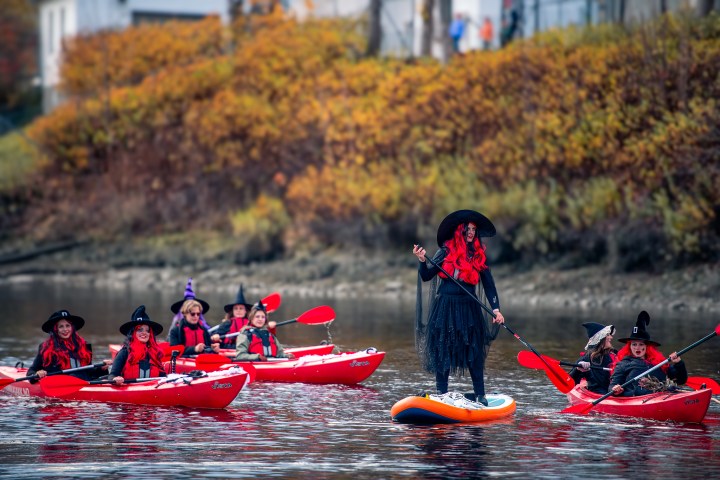 a group of people riding on the back of a boat