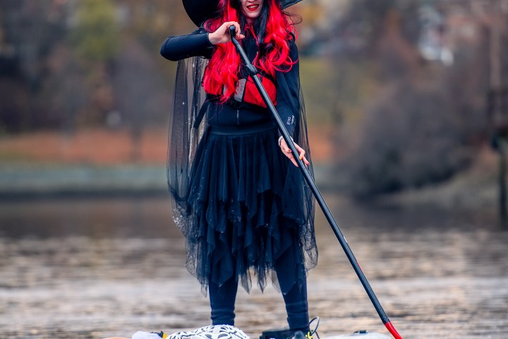a person riding a surf board on a body of water