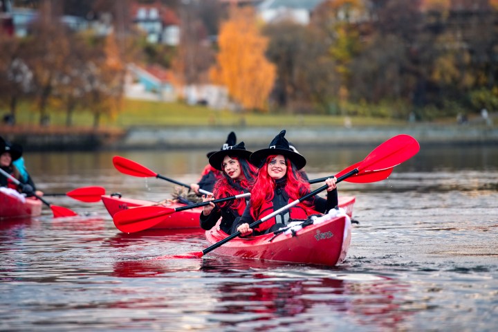 a group of people riding on the back of a boat