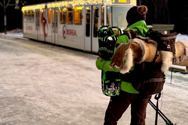 a couple of people that are standing in the snow
