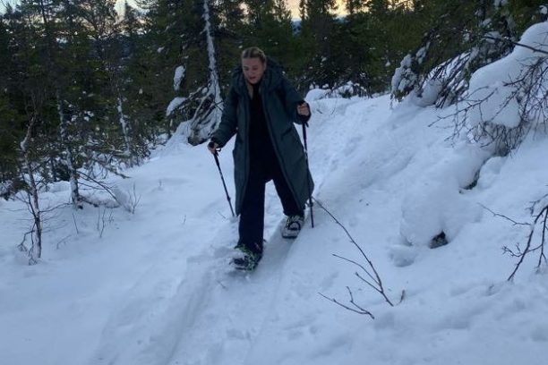 a man is cross country skiing in the snow