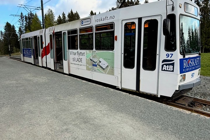 a train is parked on the side of a road